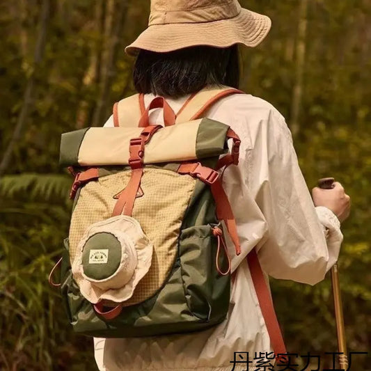 girl wear green foldable backpack